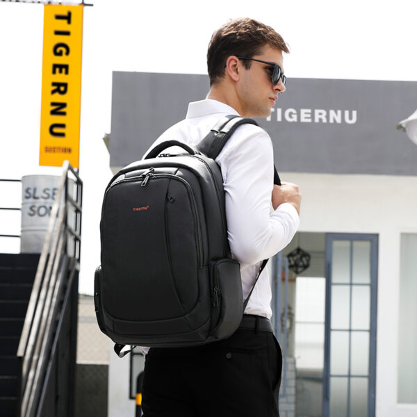 A gentalman wearing anti-theft backpack with back pocket